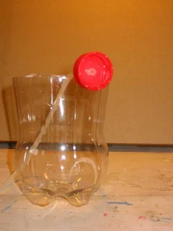 Then thread the hose through the cap and screw the cap onto the bottle.