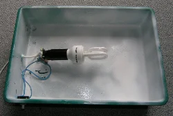 Socket and switch mounted with cord and a 7W energy-saving bulb.
